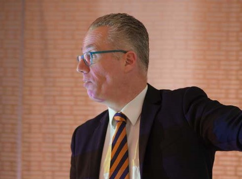 professional looking man giving a presentation